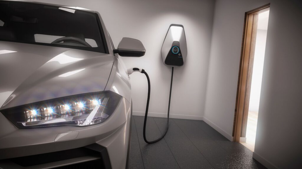 Electric vehicle parked inside a modern garage charging with a wall-mounted EV charger in Incline Village.  